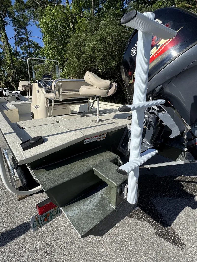 Slide: The Image of 2016 Xpress XP20CC boat with outboard motor and seating area. - 25