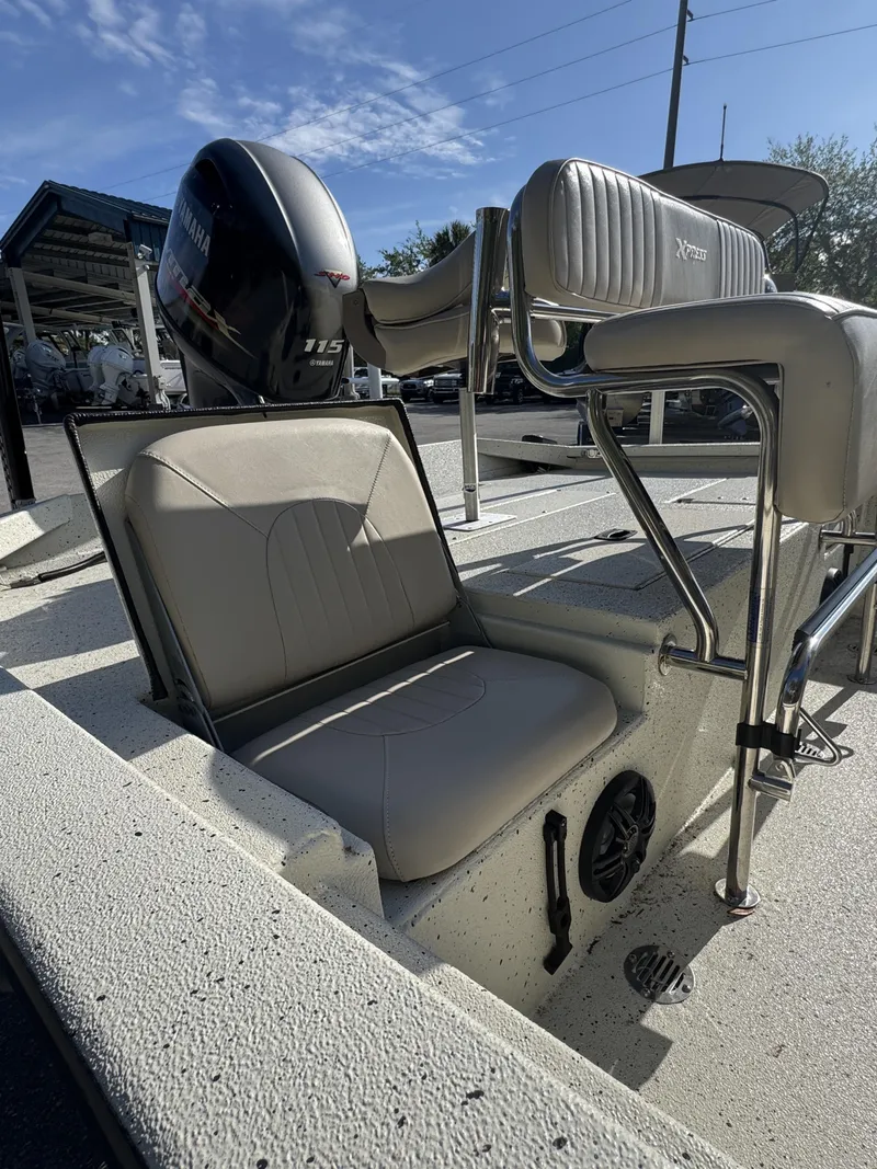 Slide: The Image of 2016 Xpress XP20CC boat with Yamaha motor and seating area. - 26