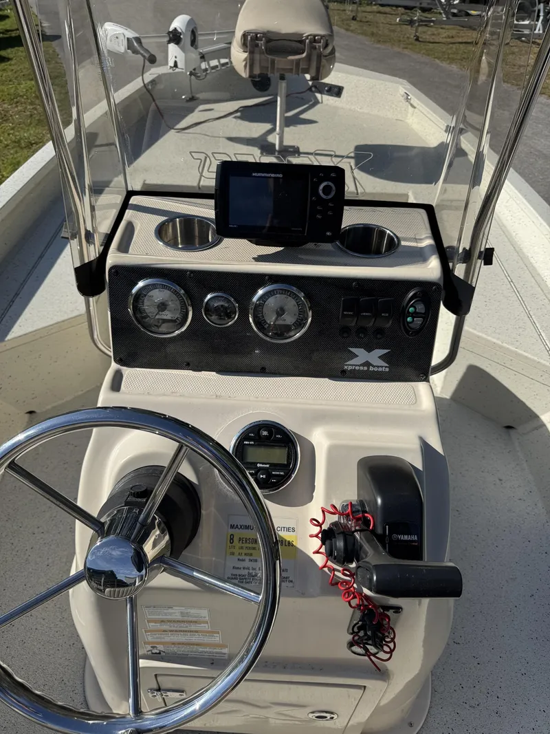 Slide: The Image of 2016 Xpress XP20CC boat console with steering wheel and instruments. - 27