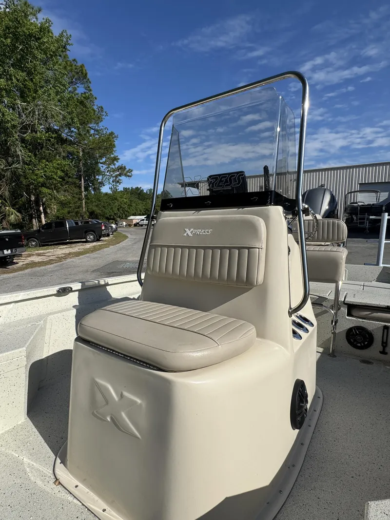 Slide: The Image of 2016 Xpress XP20CC boat with seating and windshield. - 7