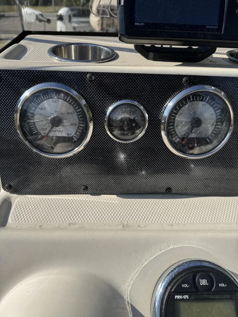 Slide: The Image of Dashboard of a 2016 Xpress XP20CC boat with gauges. - 9