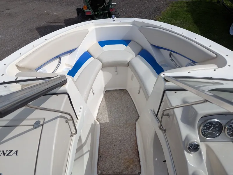 Slide: The Image of Interior of a 2006 Larson Senza 206 boat with blue accents. - 7