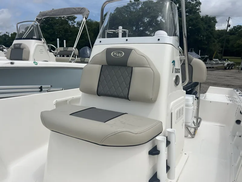 Slide: The Image of 2026 Key West 1720 boat with cushioned seat and helm console. - 3