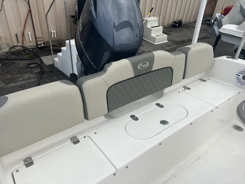 Slide: The Image of Key West 189 FS 2026 boat rear seating and motor view. - 12