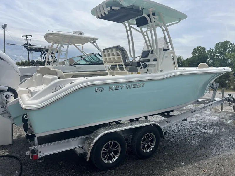 Slide: The Image of 2026 Key West 239 FS boat on trailer outdoors. - 14