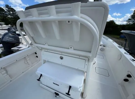 Slide: The Image of 2022 World Cat 235 CC boat with storage and fishing rod holders. - 11