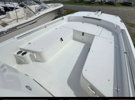 Slide: The Image of 2022 World Cat 235 CC boat with spacious deck and seating area. - 5