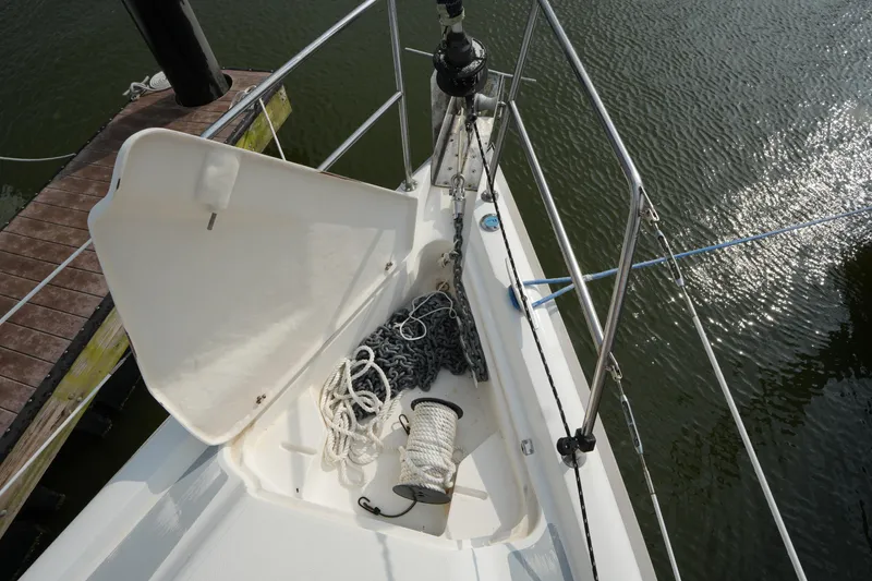 Slide: The Image of Bow of 1997 Hunter 336 sailboat with anchor chain and rope on deck. - 5