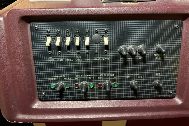Slide: The Image of Control panel of a 1989 Sea Ray 340 Express Cruiser with switches and indicators. - 15