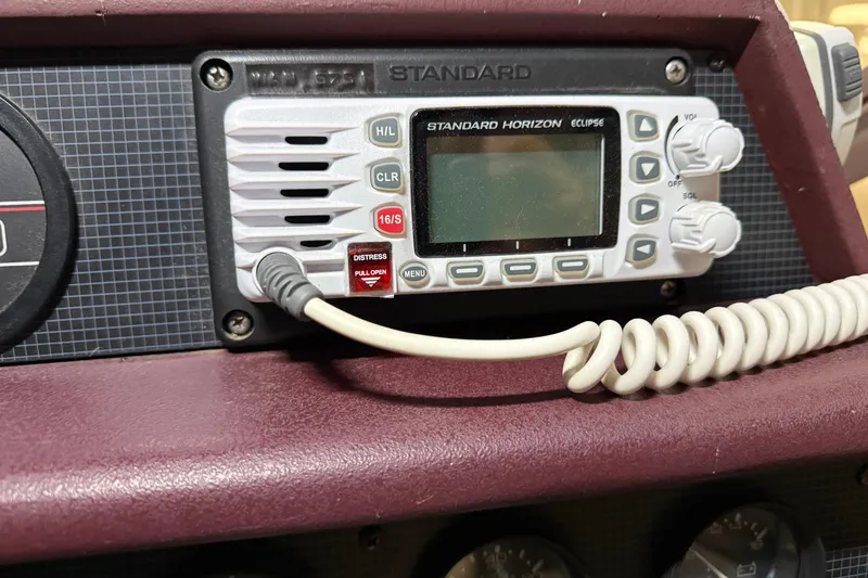 Slide: The Image of VHF radio on 1989 Sea Ray 340 Express Cruiser dashboard. - 18