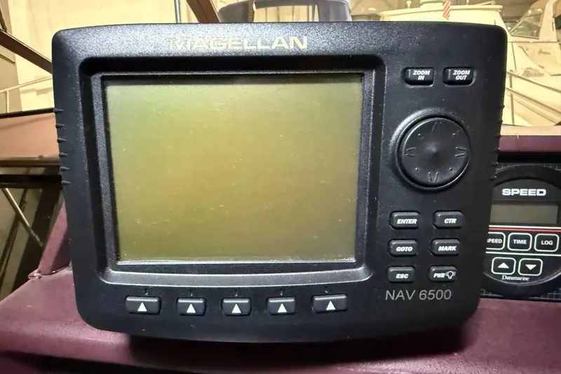 Slide: The Image of Magellan NAV 6500 GPS unit on 1989 Sea Ray 340 Express Cruiser dashboard. - 19