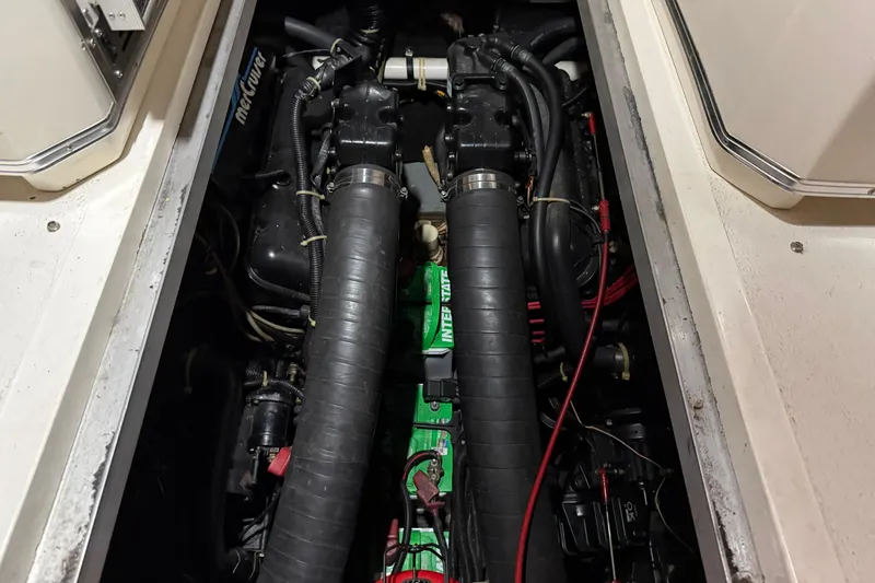 Slide: The Image of Engine compartment of a 1989 Sea Ray 340 Express Cruiser, showcasing mechanical components. - 26