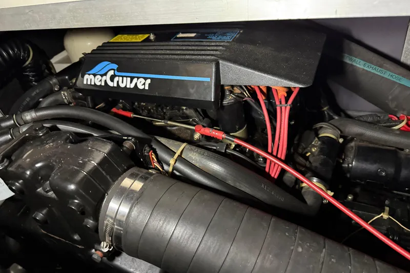 Slide: The Image of Engine compartment of a 1989 Sea Ray 340 Express Cruiser with MerCruiser components. - 27
