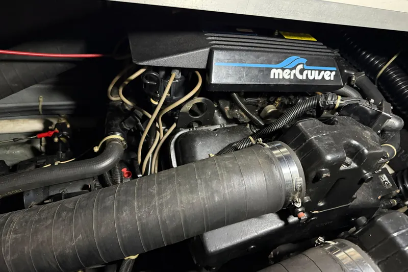 Slide: The Image of Engine compartment of a 1989 Sea Ray 340 Express Cruiser with MerCruiser components. - 28