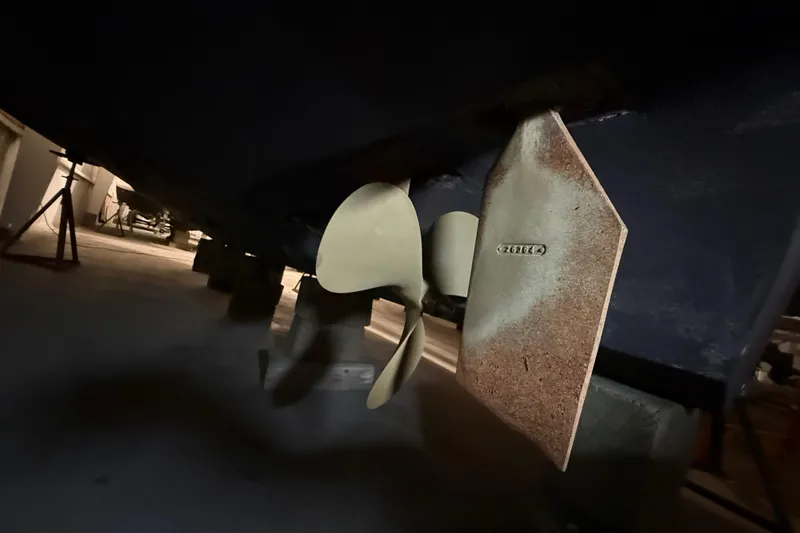 Slide: The Image of Propeller and rudder of 1989 Sea Ray 340 Express Cruiser in dry dock. - 29