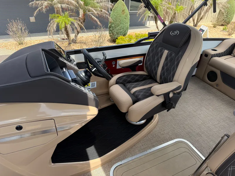 Slide: The Image of Interior of 2023 Barletta Lusso 25UE with luxurious captain's chair. - 14