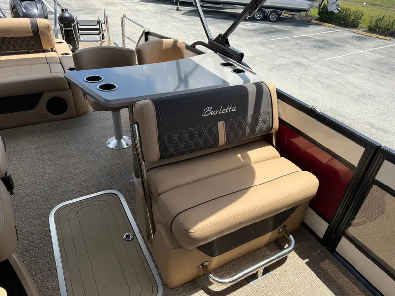 Slide: The Image of Interior of 2023 Barletta Lusso 25UE with luxurious seating and table. - 16