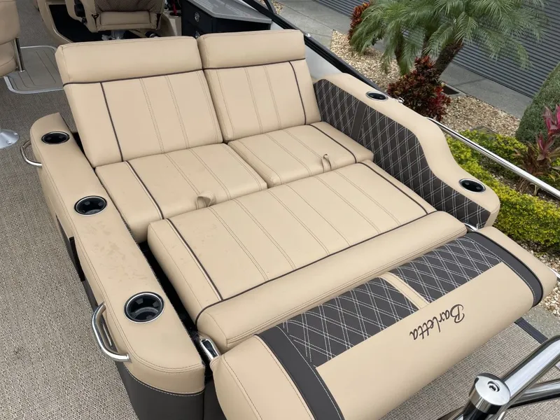 Slide: The Image of Luxurious Barletta Lusso 25UE 2023 lounge area with beige upholstery and cup holders. - 20