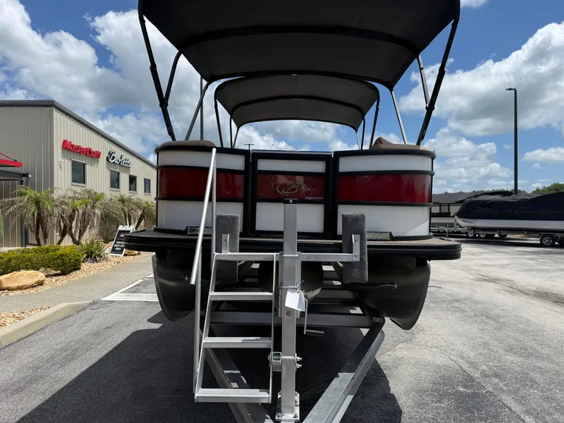Slide: The Image of 2023 Barletta Lusso 25UE pontoon boat on trailer at dealership. - 3