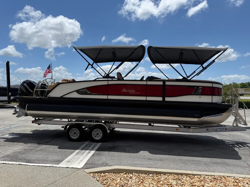 Slide: The Image of 2023 Barletta Lusso 25UE pontoon boat on trailer in sunny weather. - 5