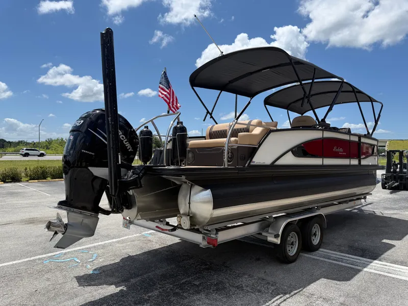 Slide: The Image of 2023 Barletta Lusso 25UE pontoon boat with Verado engine on trailer. - 6