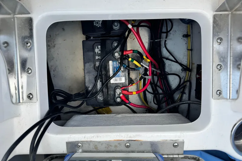 Slide: The Image of Battery compartment of a 2015 Robalo R200 Center Console boat with wiring. - 10
