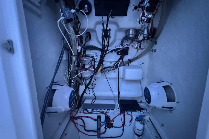 Slide: The Image of Electrical wiring and components inside a 2015 Robalo R200 Center Console boat. - 13