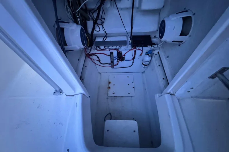 Slide: The Image of 2015 Robalo R200 Center Console boat interior wiring and equipment setup. - 14