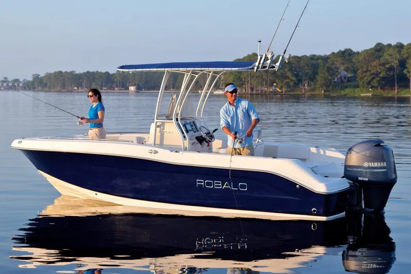 Slide: The Image of Manufacturer Provided Image: 2015 Robalo R200 Center Console boat on calm water with two people fishing. - 15
