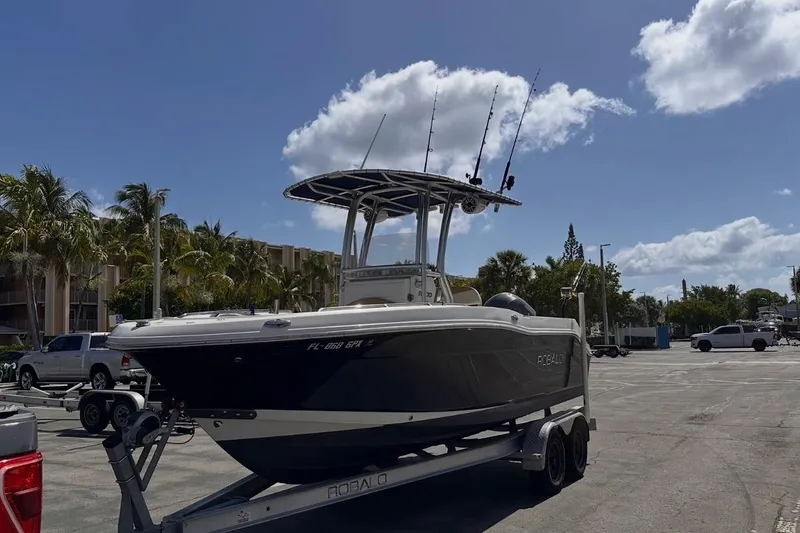 Slide: The Image of 2015 Robalo R200 Center Console boat on trailer under blue sky. - 2