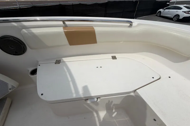 Slide: The Image of 2015 Robalo R200 Center Console boat interior with seating and storage compartment. - 27