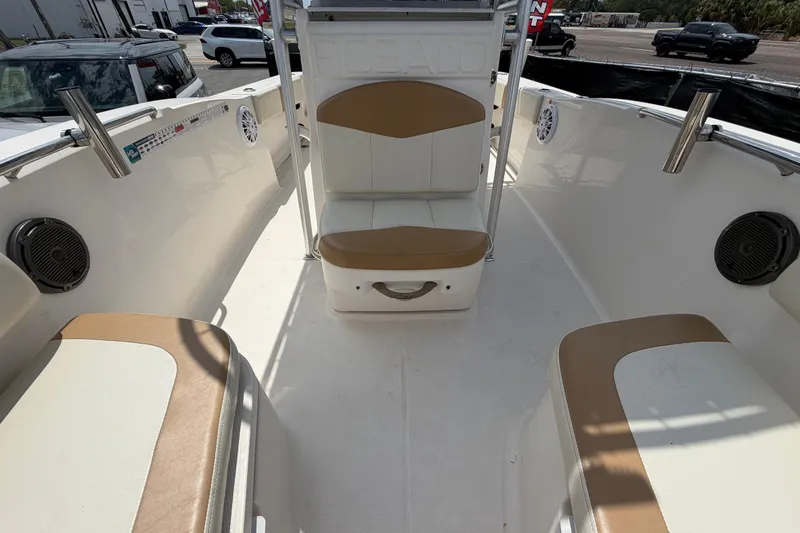 Slide: The Image of 2015 Robalo R200 Center Console boat interior with seating and speakers. - 36
