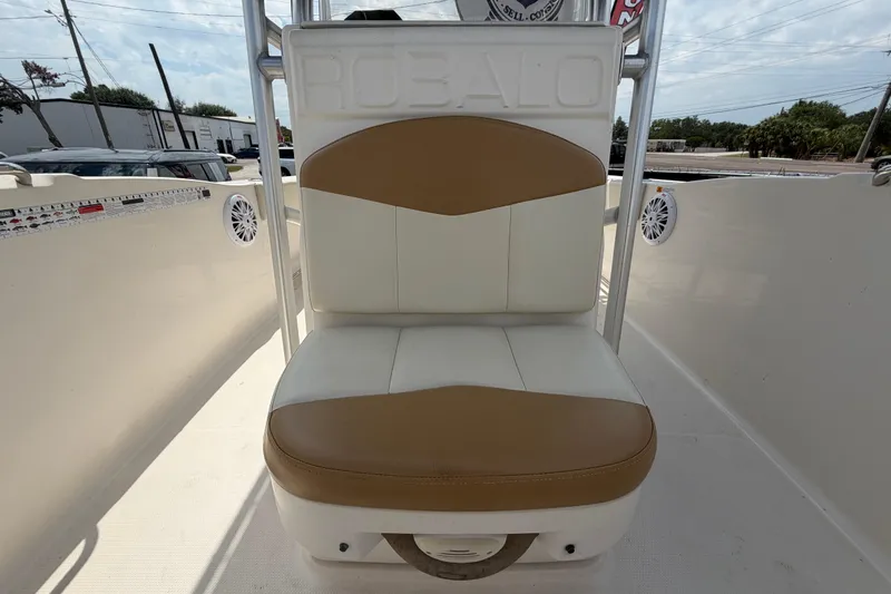 Slide: The Image of 2015 Robalo R200 Center Console boat seat with tan and white upholstery. - 37