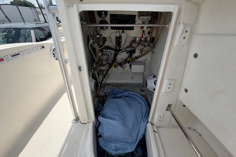 Slide: The Image of 2015 Robalo R200 Center Console interior wiring and storage area view. - 39