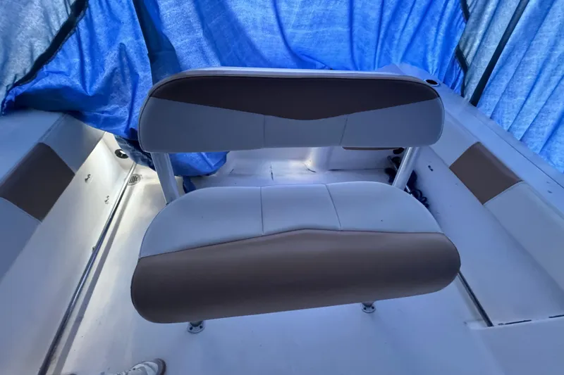 Slide: The Image of 2015 Robalo R200 Center Console boat interior with cushioned seating. - 8