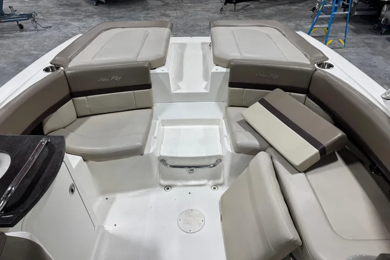 Slide: The Image of Interior seating of a 2011 Sea Ray SLX 250 boat with beige upholstery. - 7