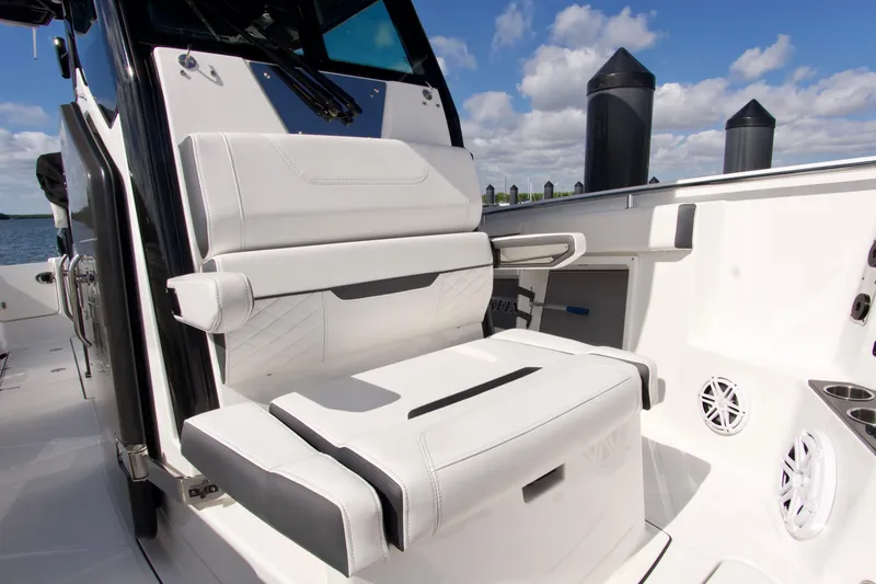 Slide: The Image of 2023 Blackfin 302 CC boat interior with white seating and modern design. - 23