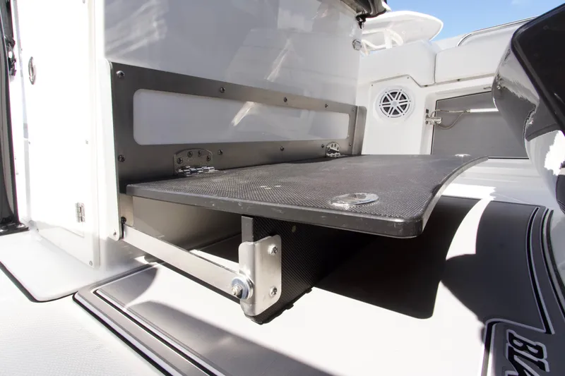 Slide: The Image of 2023 Blackfin 302 CC boat interior detail with foldable platform and speaker. - 31