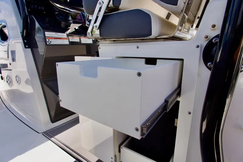 Slide: The Image of 2023 Blackfin 302 CC boat interior with open storage drawer. - 39