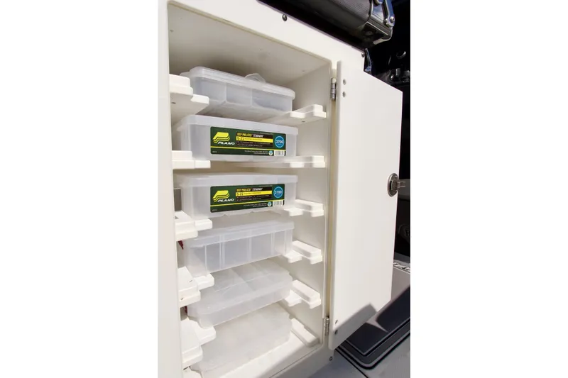 Slide: The Image of Storage cabinet with organized tackle boxes on a 2023 Blackfin 302 CC boat. - 40