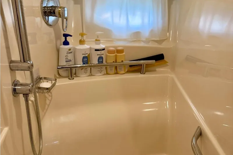 Slide: The Image of Shower area in 2006 Sea Ray Sundancer 400 yacht with toiletries and chrome fixtures. - 20