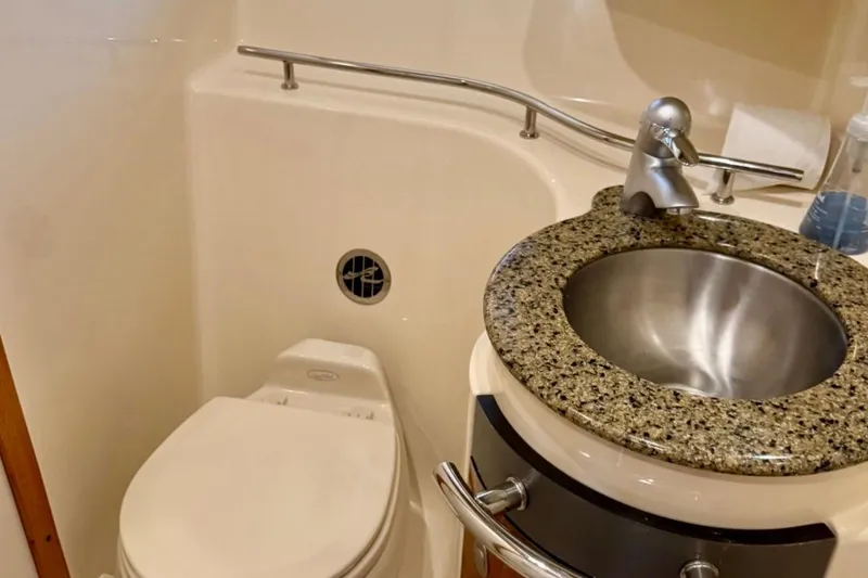 Slide: The Image of Bathroom interior of 2006 Sea Ray Sundancer 400 yacht with granite sink and toilet. - 21