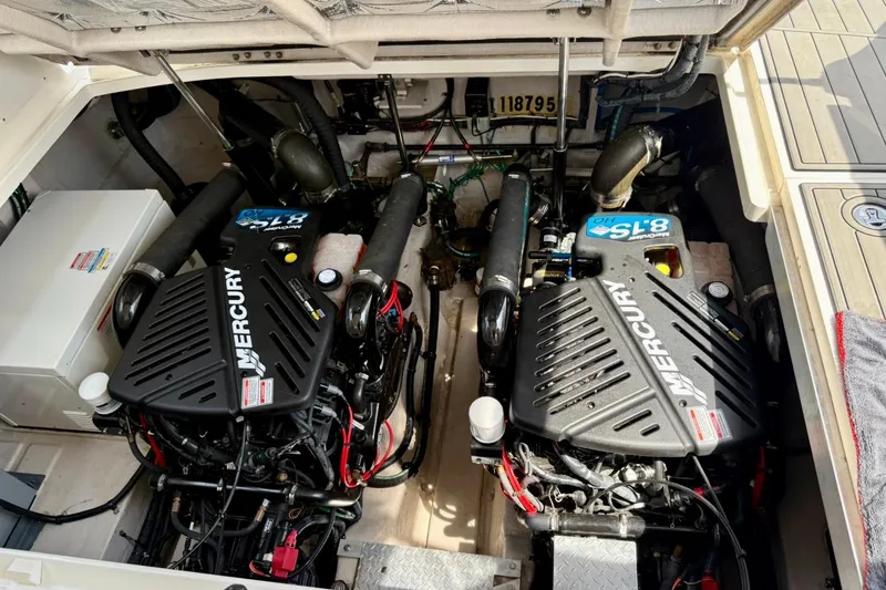 Slide: The Image of Engine compartment of a 2006 Sea Ray Sundancer 400 with twin Mercury engines. - 23