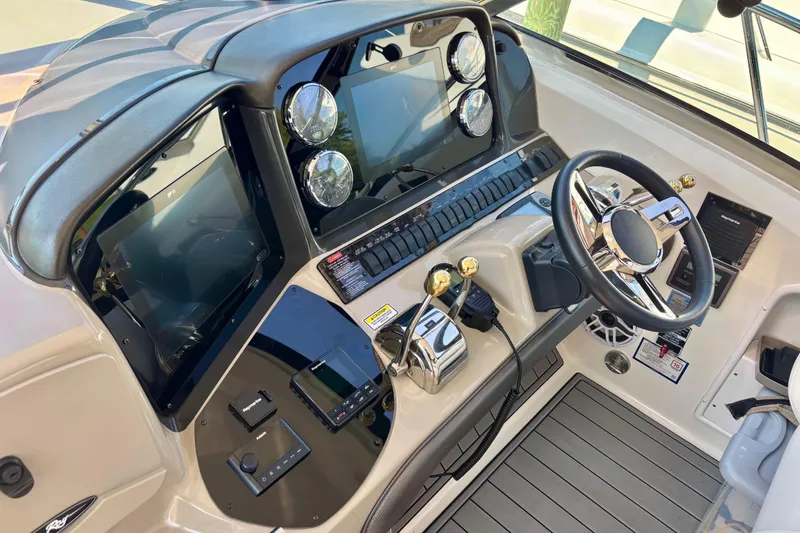 Slide: The Image of Helm of 2006 Sea Ray Sundancer 400 with modern controls and navigation displays. - 6