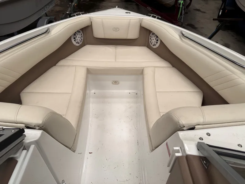 Slide: The Image of Interior of a 2009 Cobalt 230BR boat with beige seating. - 4