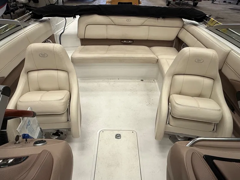 Slide: The Image of Interior of a 2009 Cobalt 230BR boat with beige leather seating. - 5