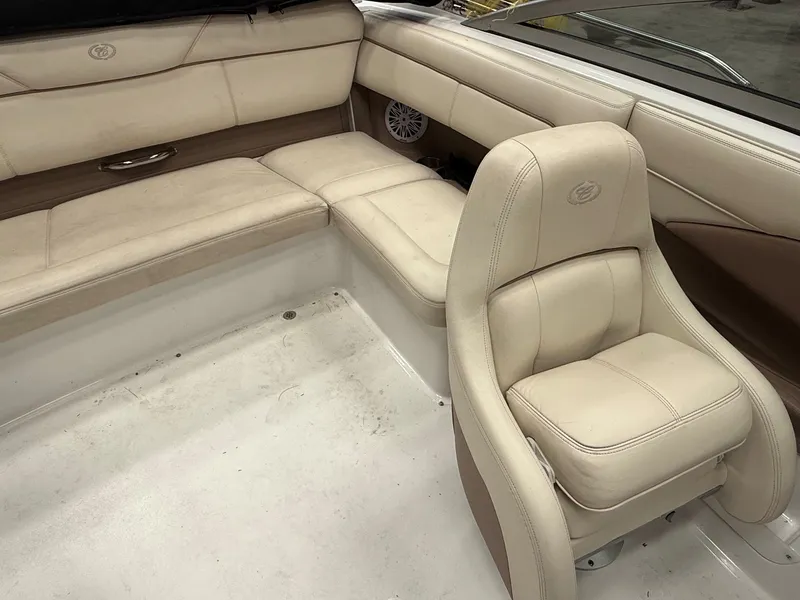 Slide: The Image of Interior of a 2009 Cobalt 230BR boat with beige leather seats. - 6