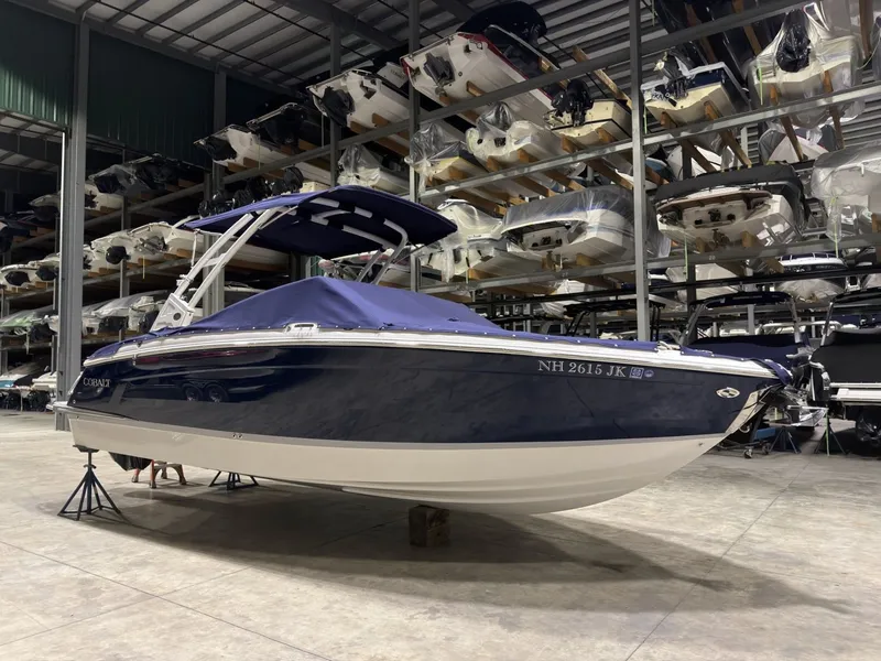 Slide: The Image of 2022 Cobalt R6 boat in storage facility, blue cover. - 10