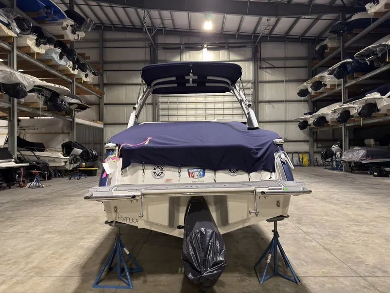 Slide: The Image of 2022 Cobalt R6 boat stored on stands in warehouse. - 12