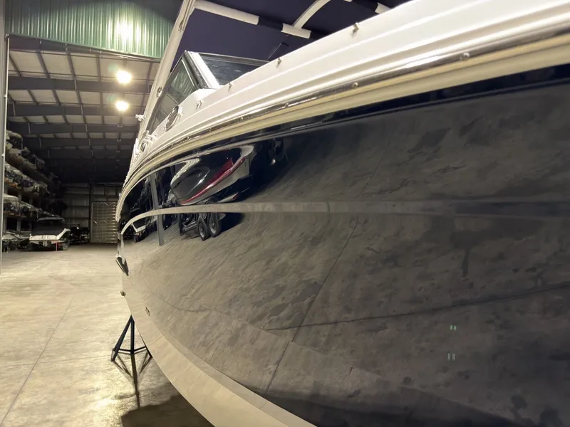 Slide: The Image of 2022 Cobalt R6 boat in warehouse, side view. - 16